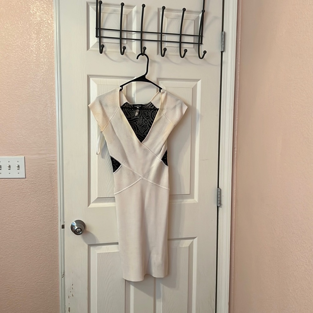 White Bebe dress with black lace backing. Always dry cleaned, smoke-free home.